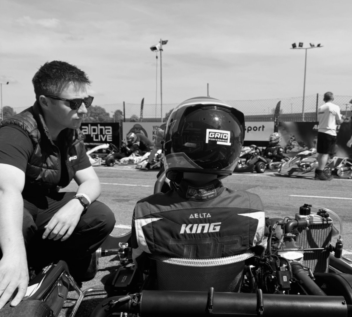 Coach and driver talking in the paddock